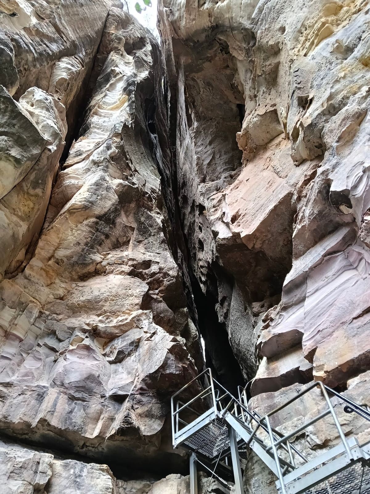 The narrow sandstone entrance to the Amphitheatre, reached by a short ladder climb, Carnarvon Gorge