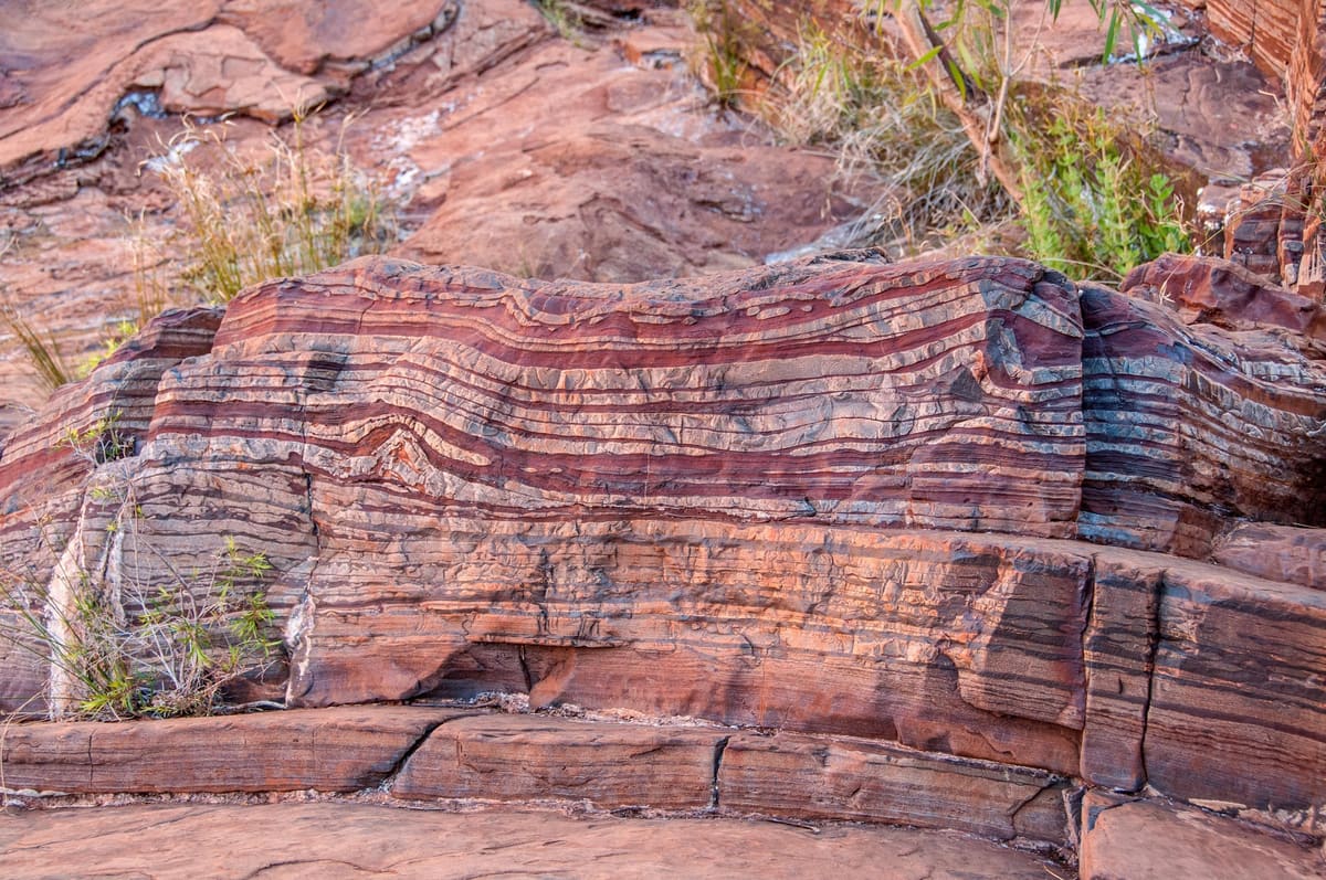 Tightly folded red, purple and grey banded iron formation layers in Dales Gorge